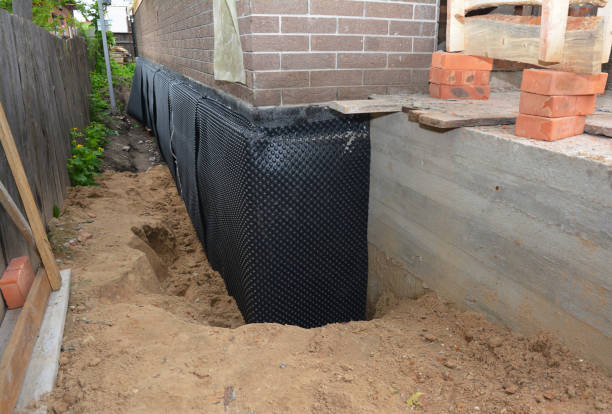 Happy homeowners after waterproofing job in Montrose